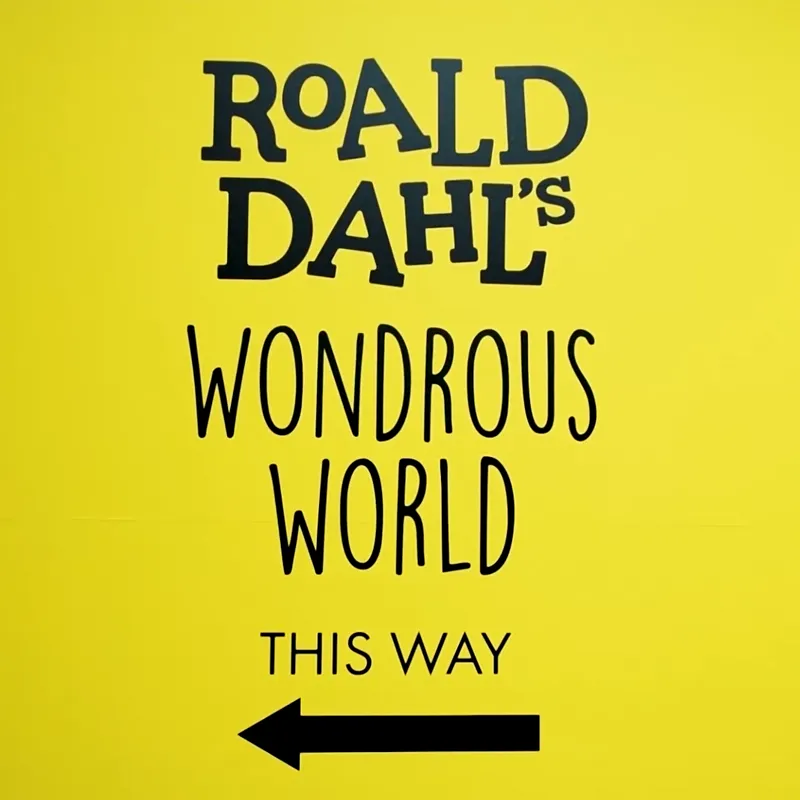 Text on yellow wall that reads Roald Dahl's Wondrous World and an arrow pointing to the left