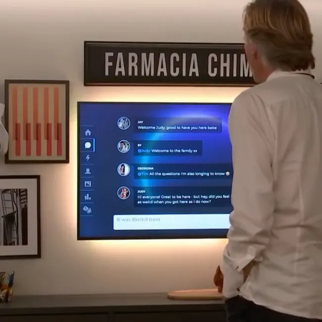 A man looks at a social feed from The Circle on a screen